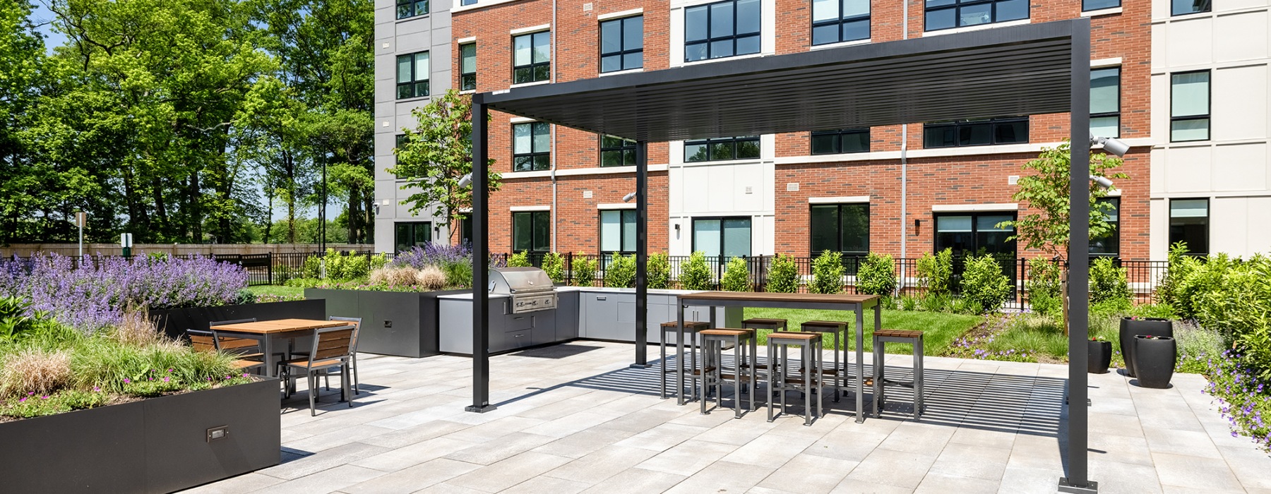 outdoor courtyard with seating and grills