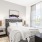 a bedroom with a large window