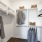 closet with organizers and clothes hanging