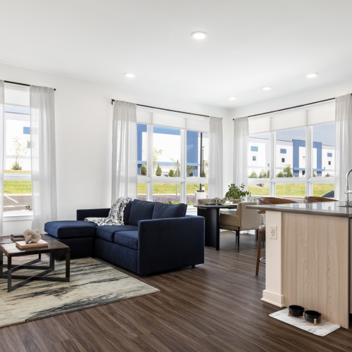 A peaceful space to come home to living room and kitchen with island
