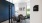 meeting room with round table chairs and dark blue wall