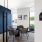 meeting room with round table chairs and dark blue wall