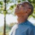 a man outside taking a breath of air in the sun