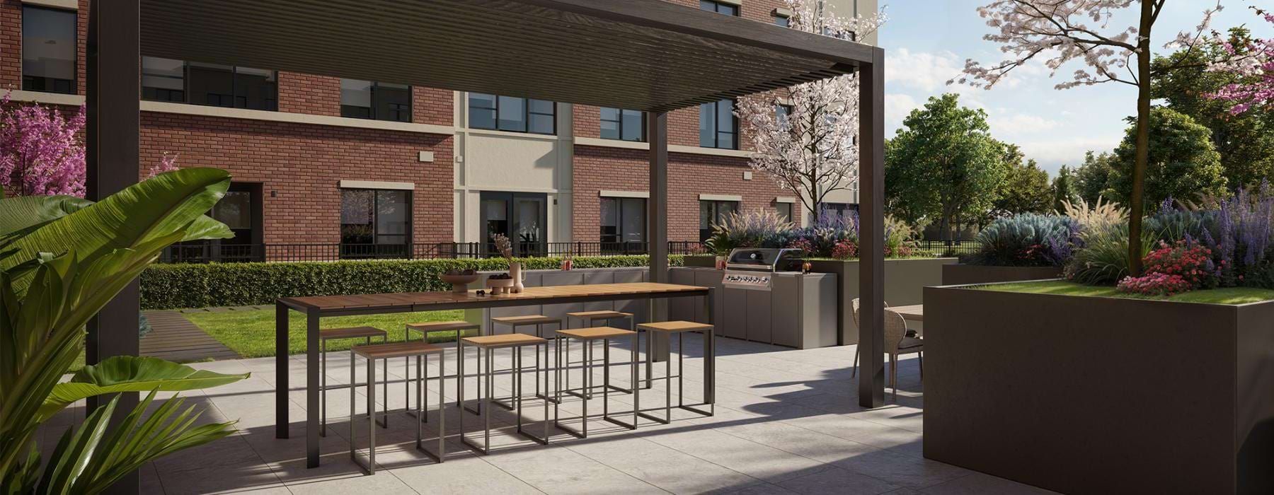 outdoor kitchen and grill area with seating