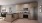 a kitchen with a stainless steel refrigerator